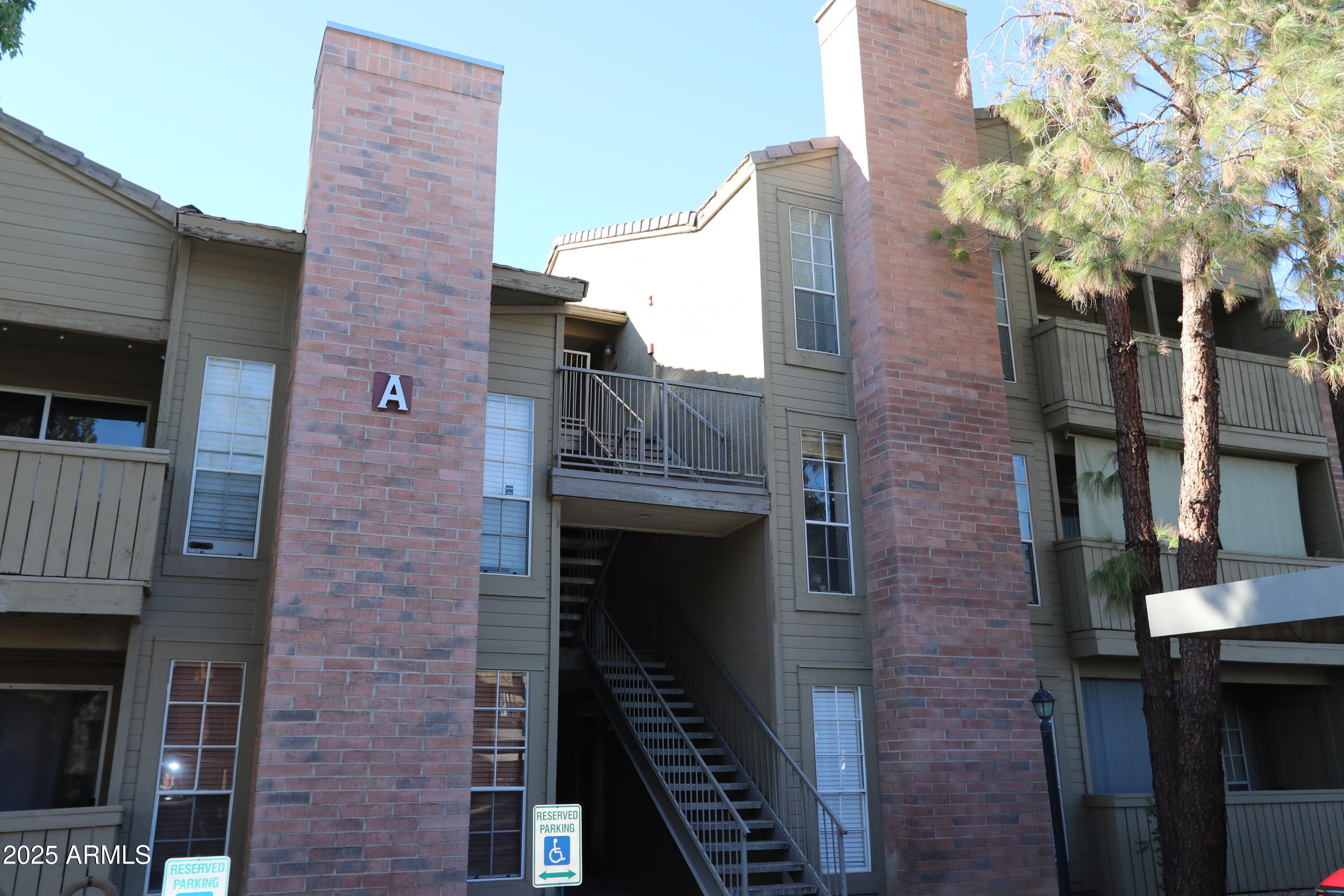 200 East Southern Avenue, Unit 307 Tempe, AZ 85282 - Photo 16 of 16 a brick building with a tree in front of it