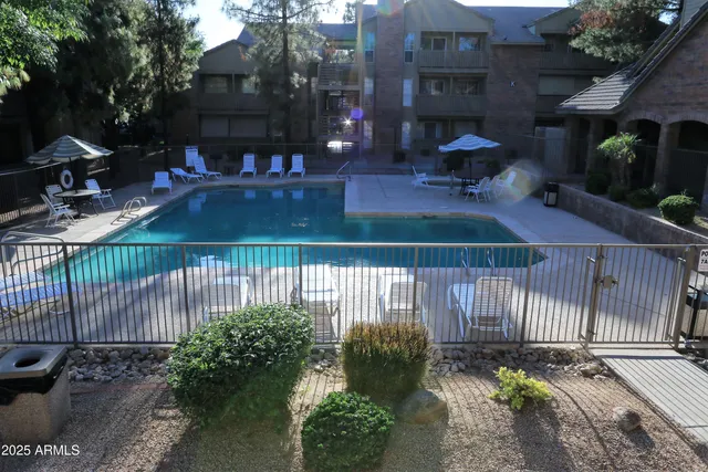 a view of a patio with a table and chairs