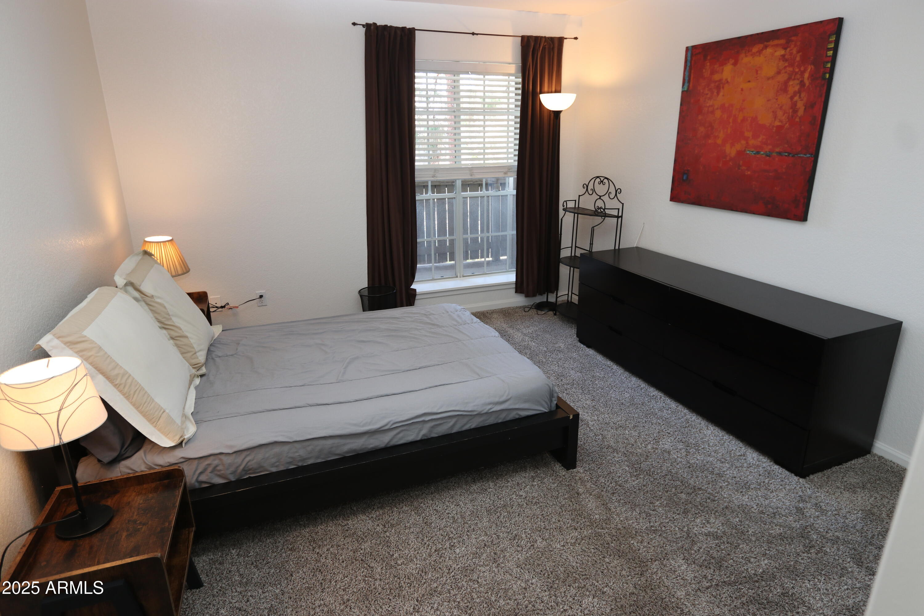 200 East Southern Avenue, Unit 307 Tempe, AZ 85282 - Photo 8 of 16 a bedroom with a bed and a window