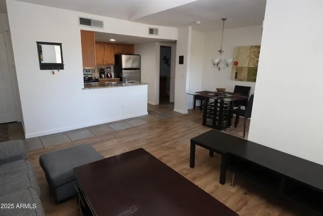 a view of a dining room with furniture and wooden floor