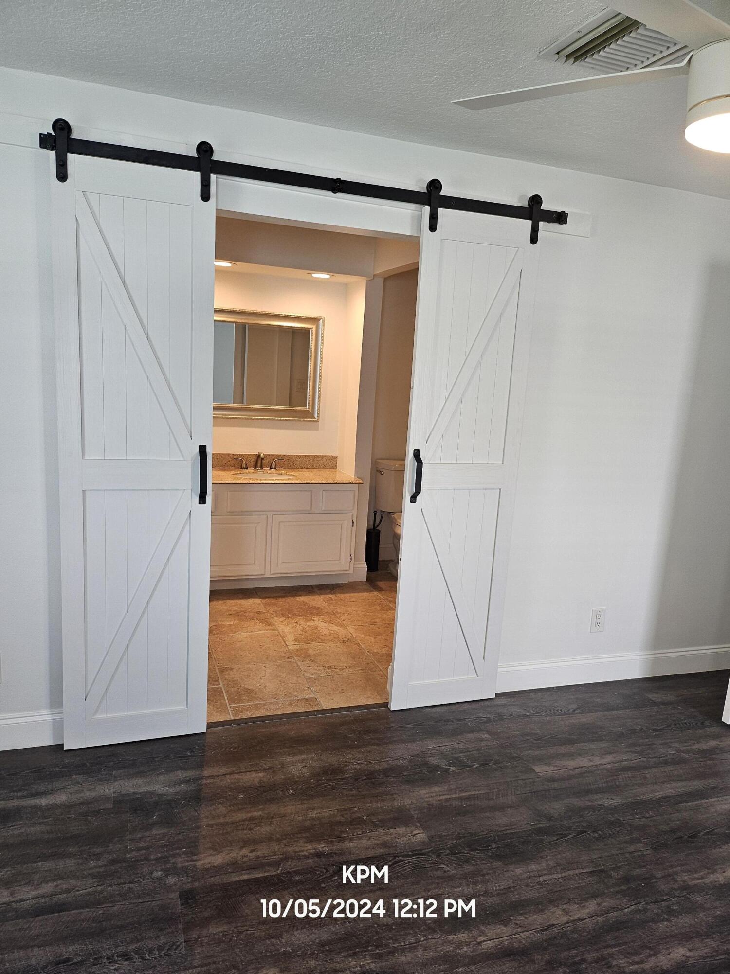 105 Wingate Drive Jupiter, FL 33458 - Photo 26 of 43 barn door master bath