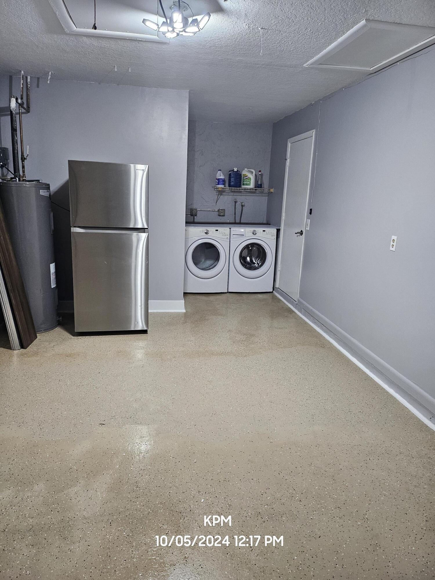 105 Wingate Drive Jupiter, FL 33458 - Photo 39 of 43 garage with washer dryer