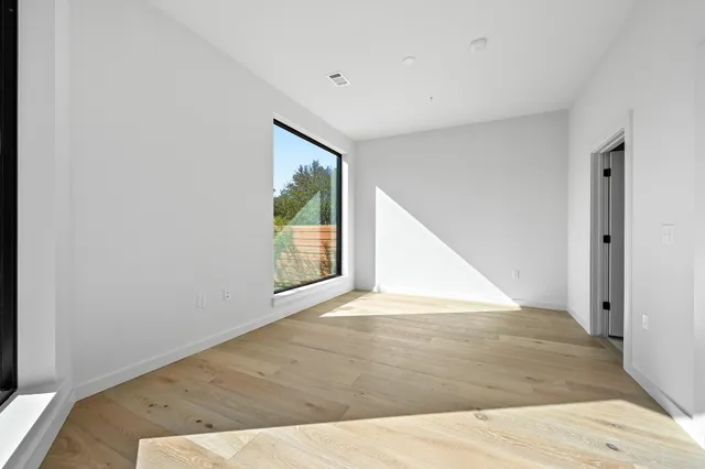 a view of a living room with wooden floor