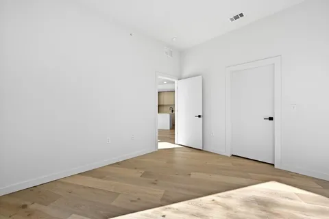 a view of a room with a large window