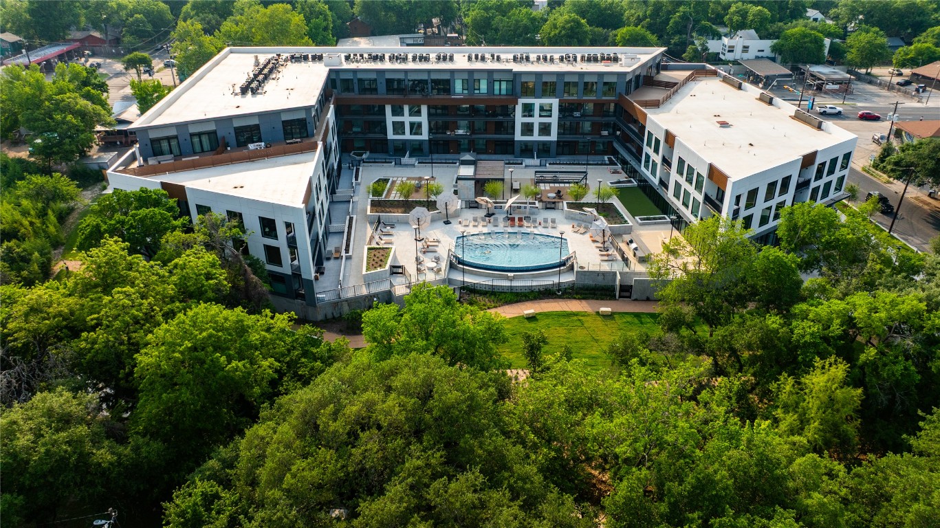 2209 South 1st Street, Unit 114 Austin, TX 78704 - Photo 24 of 27 an aerial view of a house with garden space and patio