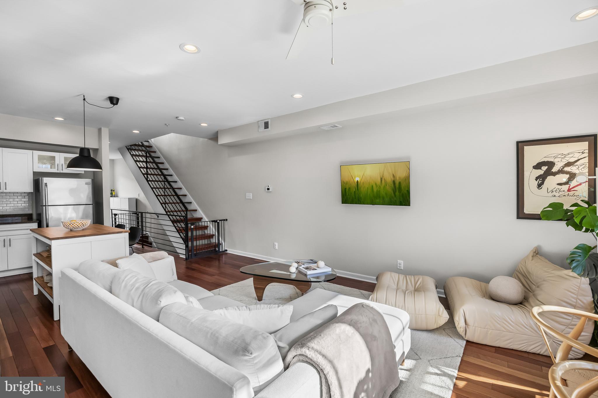 1627 Fairmount Avenue, Unit B Philadelphia, PA 19130 - Photo 15 of 46 a living room with furniture and wooden floor