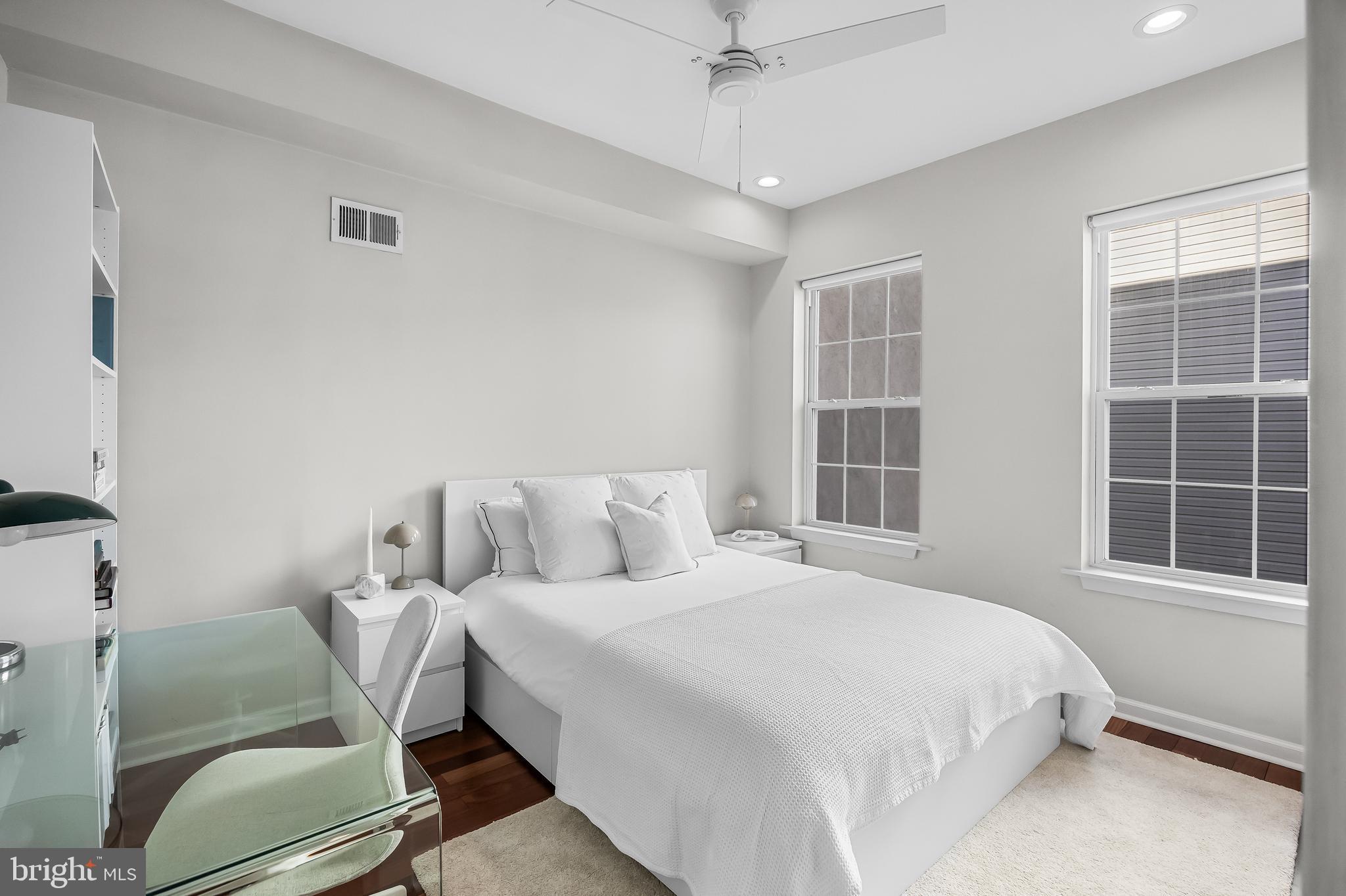 1627 Fairmount Avenue, Unit B Philadelphia, PA 19130 - Photo 18 of 46 a bedroom with a bed and windows