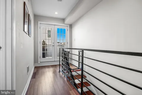 a view of entryway with wooden floor