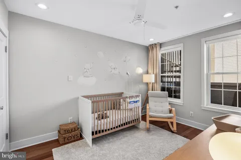 a bedroom with furniture and a window