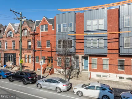 a view of a car parked in front of a building