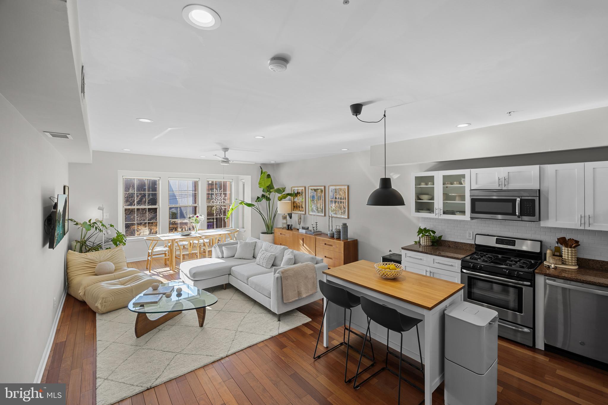1627 Fairmount Avenue, Unit B Philadelphia, PA 19130 - Photo 6 of 46 a living room with furniture fireplace and flat screen tv