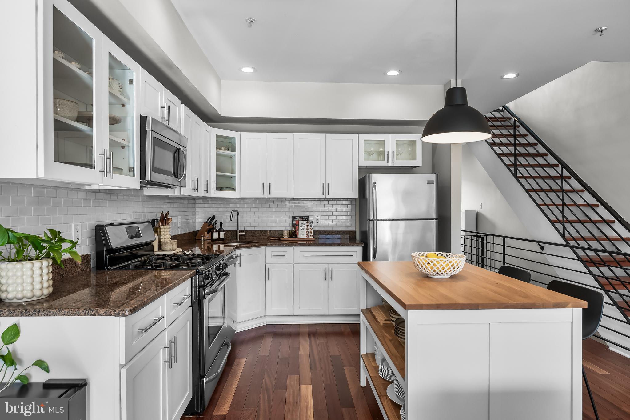 1627 Fairmount Avenue, Unit B Philadelphia, PA 19130 - Photo 10 of 46 a kitchen with a sink a stove and cabinets