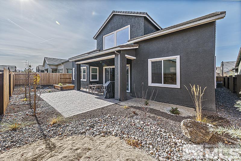 9460 Baldacci Road Reno, NV 89521 - Photo 24 of 25 a backyard of a house with barbeque oven and outdoor seating