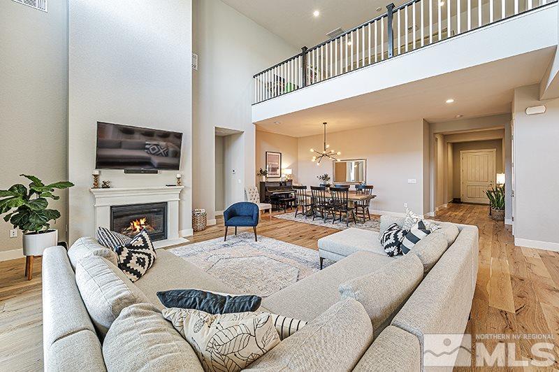 9460 Baldacci Road Reno, NV 89521 - Photo 5 of 25 a living room with furniture a fireplace and a flat screen tv