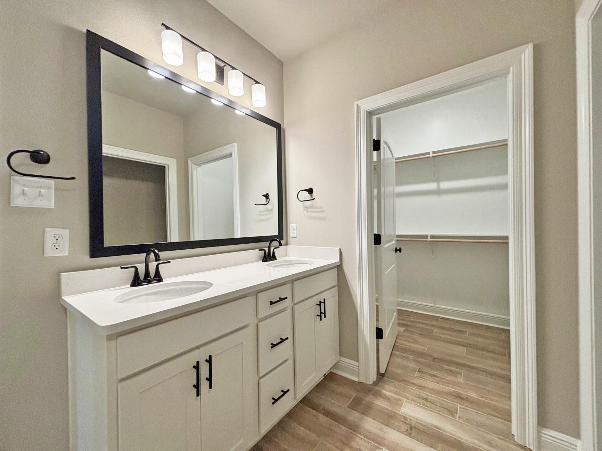 75 Natureview Way Ponce de Leon, FL 32455 - Photo 11 of 23 a bathroom with a double vanity sink and mirror