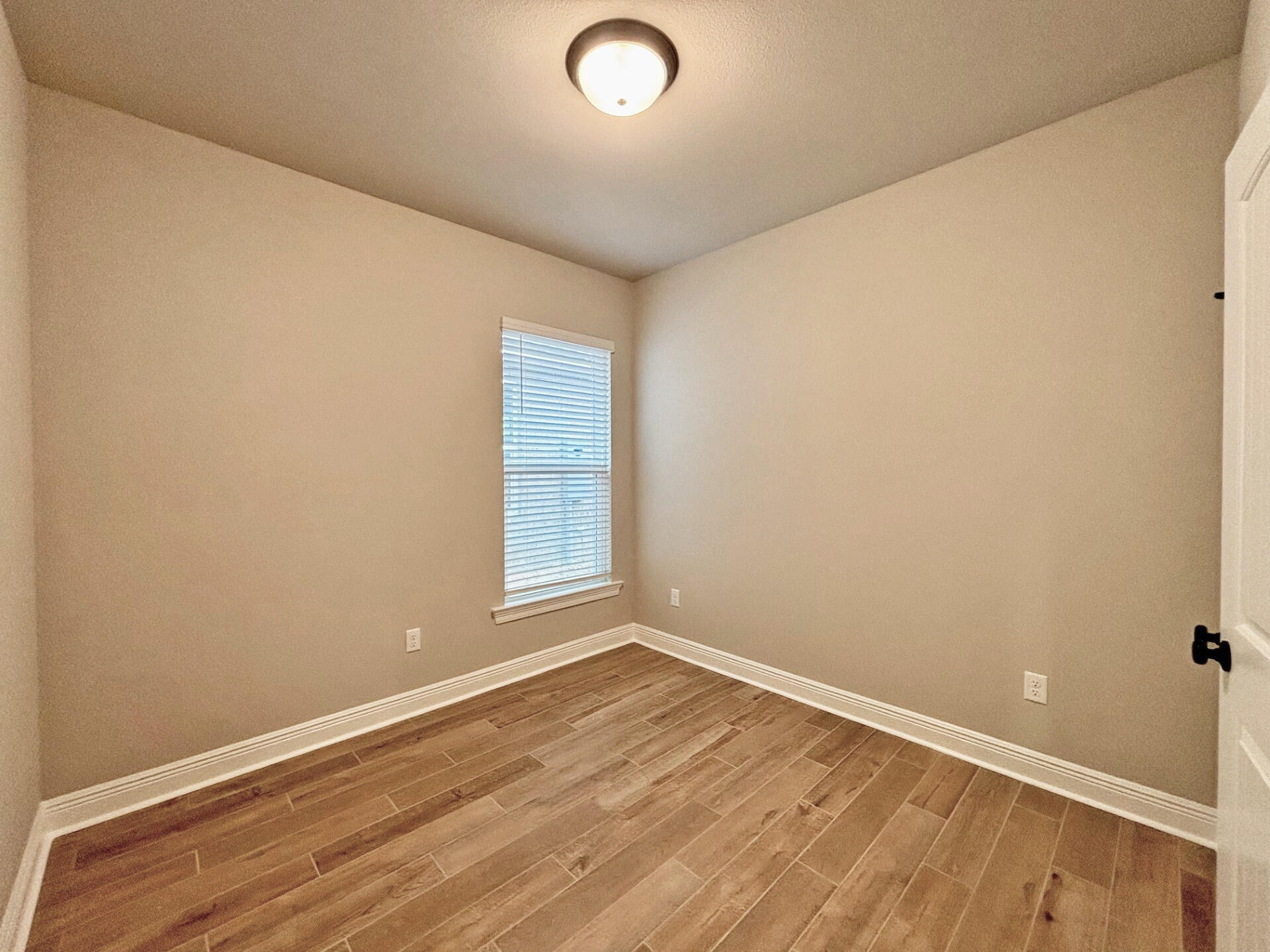 75 Natureview Way Ponce de Leon, FL 32455 - Photo 15 of 23 an empty room with wooden floor and windows