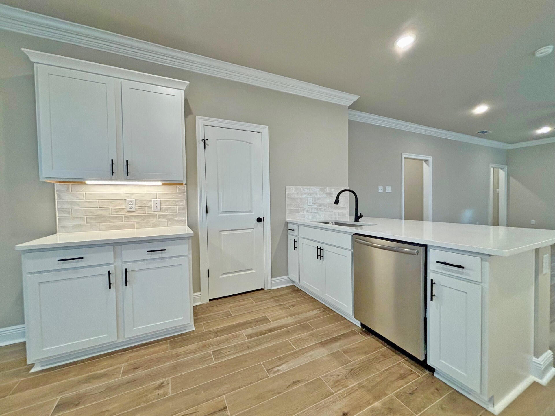 75 Natureview Way Ponce de Leon, FL 32455 - Photo 4 of 23 a kitchen with white cabinets and sink