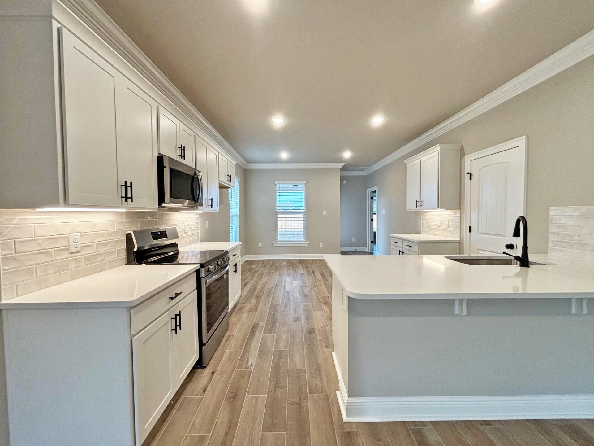 75 Natureview Way Ponce de Leon, FL 32455 - Photo 6 of 23 a large kitchen with stainless steel appliances lots of counter space and a sink