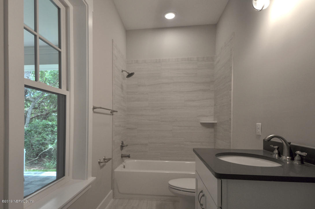 448 Ridgeway Road St. Augustine Beach, FL 32080 - Photo 11 of 23 a bathroom with a sink a toilet and tub