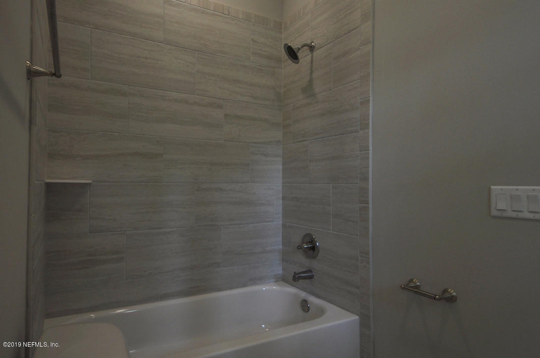 448 Ridgeway Road St. Augustine Beach, FL 32080 - Photo 15 of 23 a close up of a bathtub