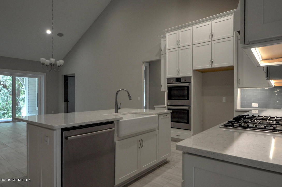 448 Ridgeway Road St. Augustine Beach, FL 32080 - Photo 6 of 23 a kitchen with stainless steel appliances granite countertop a sink stove and refrigerator