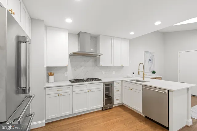 a kitchen with a sink stove and refrigerator
