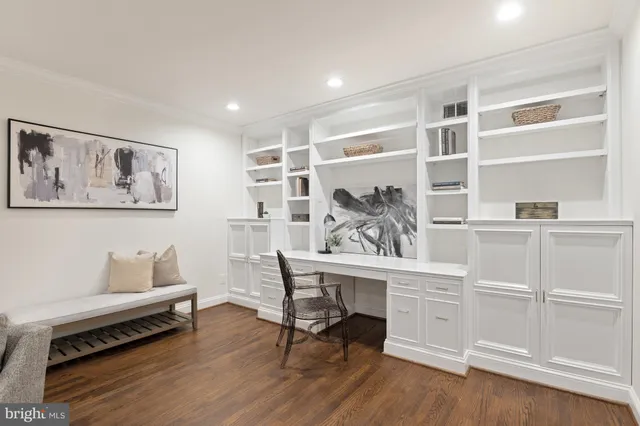 a workspace with wooden floor and a cabinet