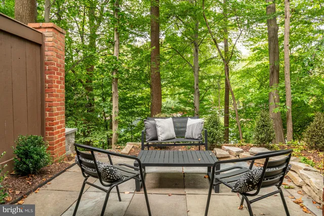 a view of a outdoor sitting area with furniture