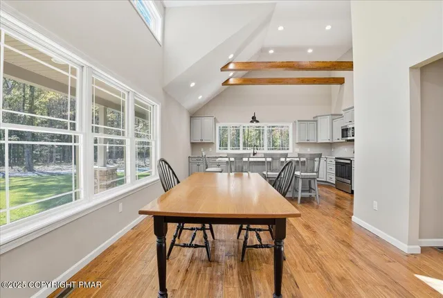 a view of a house with swimming pool and sitting area