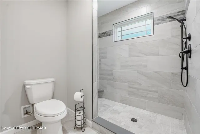 a front view of a house with a yard table and chairs