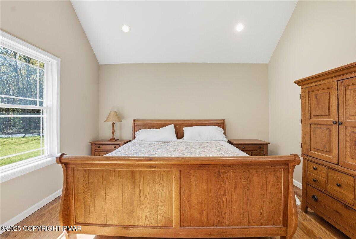 154 Sterner Run Road Kunkletown, PA 18058 - Photo 26 of 104 a bedroom with a bed and wooden floor