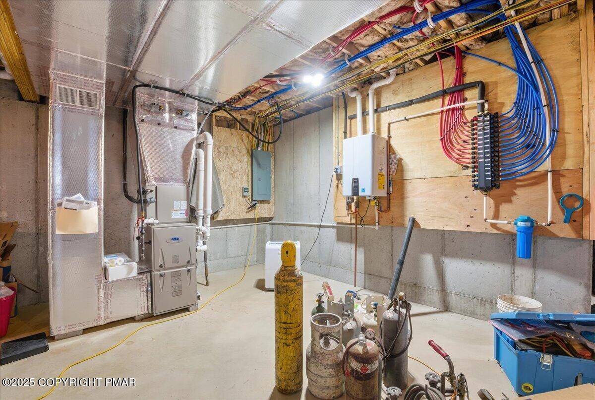 154 Sterner Run Road Kunkletown, PA 18058 - Photo 48 of 104 a view of walk in closet with clothes and shoes