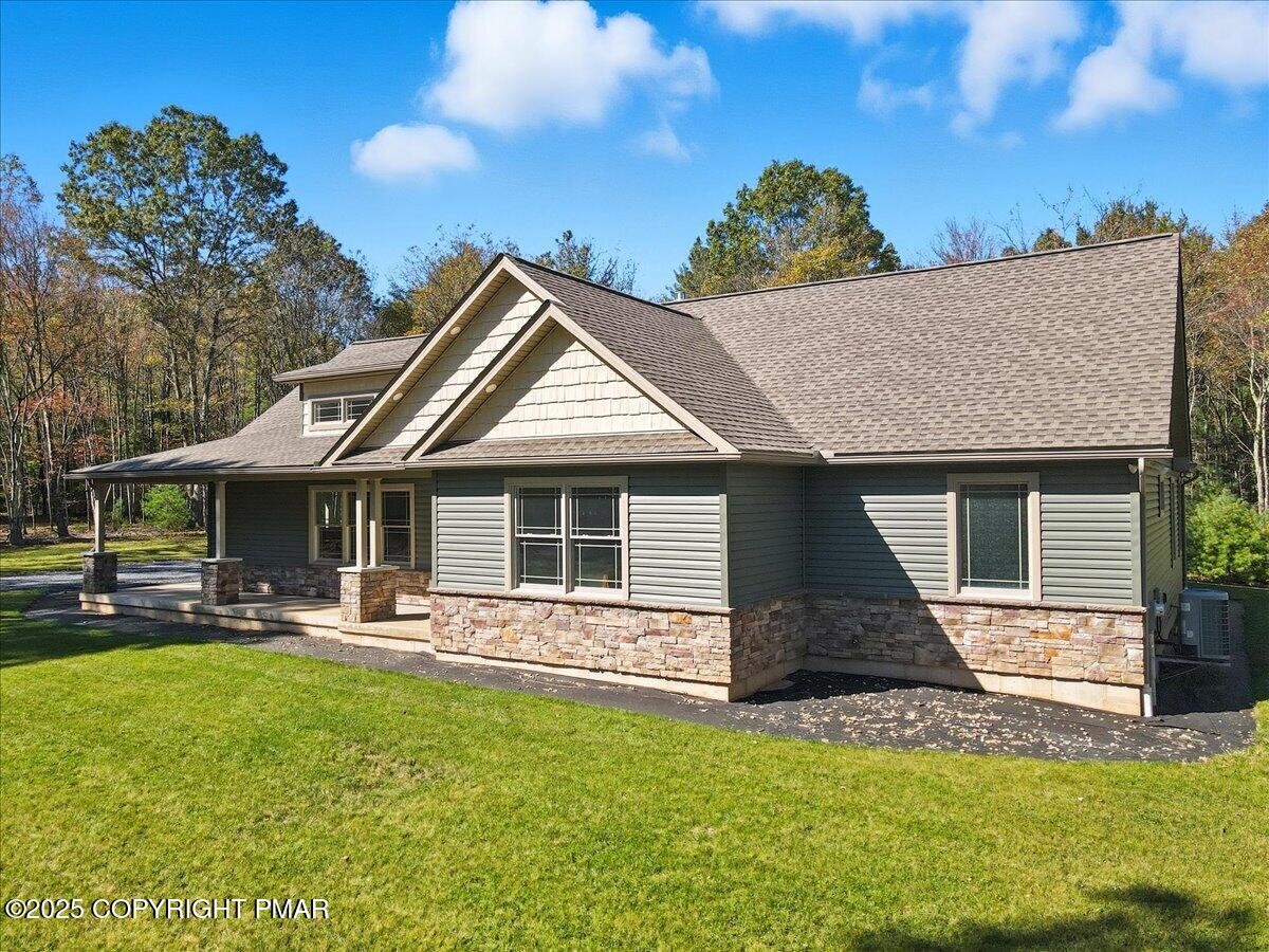 154 Sterner Run Road Kunkletown, PA 18058 - Photo 73 of 104 a front view of a house with a yard table and chairs