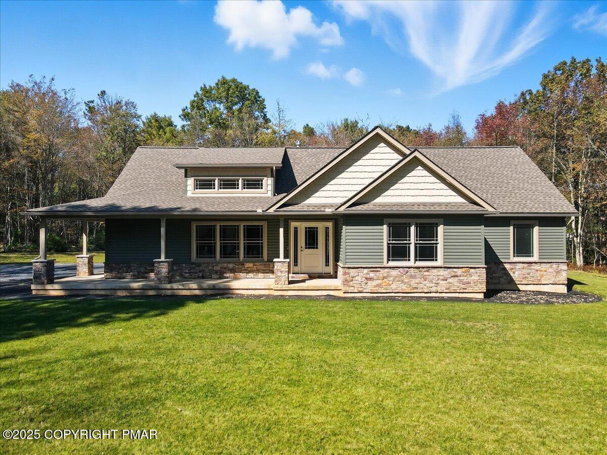 154 Sterner Run Road Kunkletown, PA 18058 - Photo 75 of 104 a front view of a house with a yard table and chairs