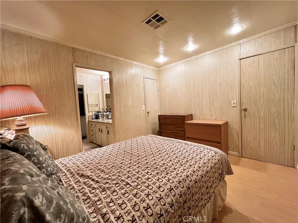a bed room with a bed and a lamp