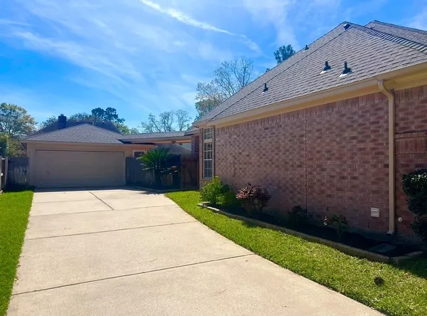 a pathway of a house with a yard
