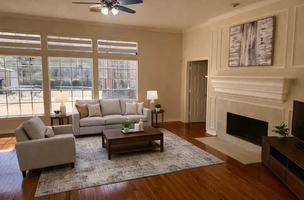 a living room with furniture and a fireplace