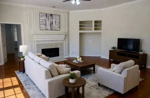 a living room with furniture and a flat screen tv