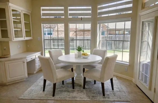 a view of a dining room with furniture window and outside view