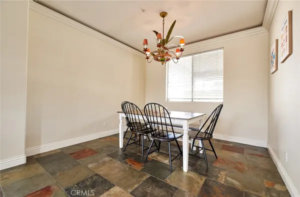 a view of a dining room with furniture and window