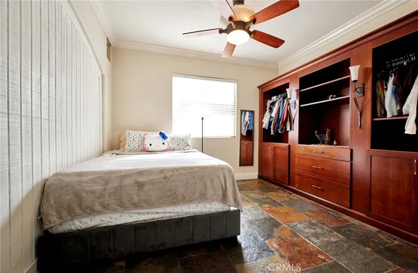 a bedroom with a bed and a walk in closet