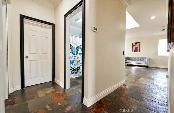 a view of a hallway with dining area