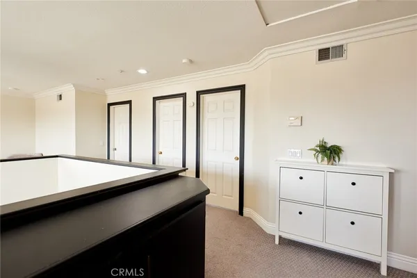 a bedroom with a bed and flat screen tv