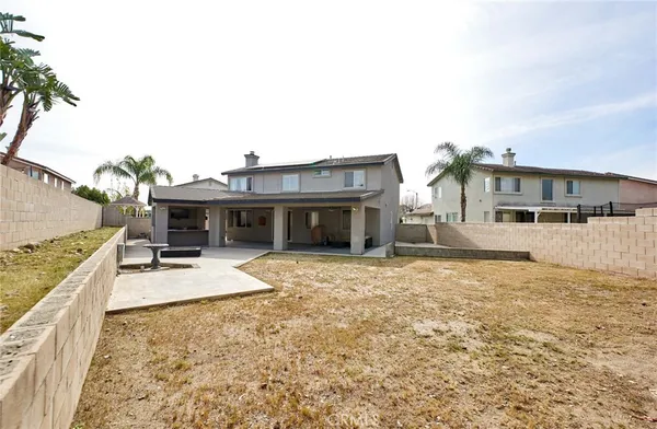 a kitchen with stainless steel appliances white cabinets and a stove top oven