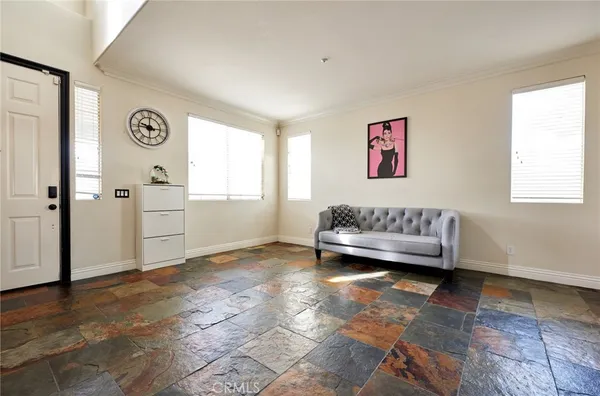 a view of a livingroom with a couch and a window