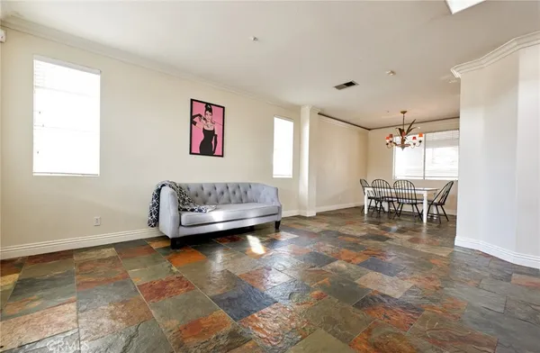 a view of a livingroom with furniture and a window