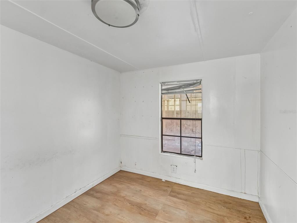 7275 Knowles Road Polk City, FL 33868 - Photo 13 of 39 an empty room with windows