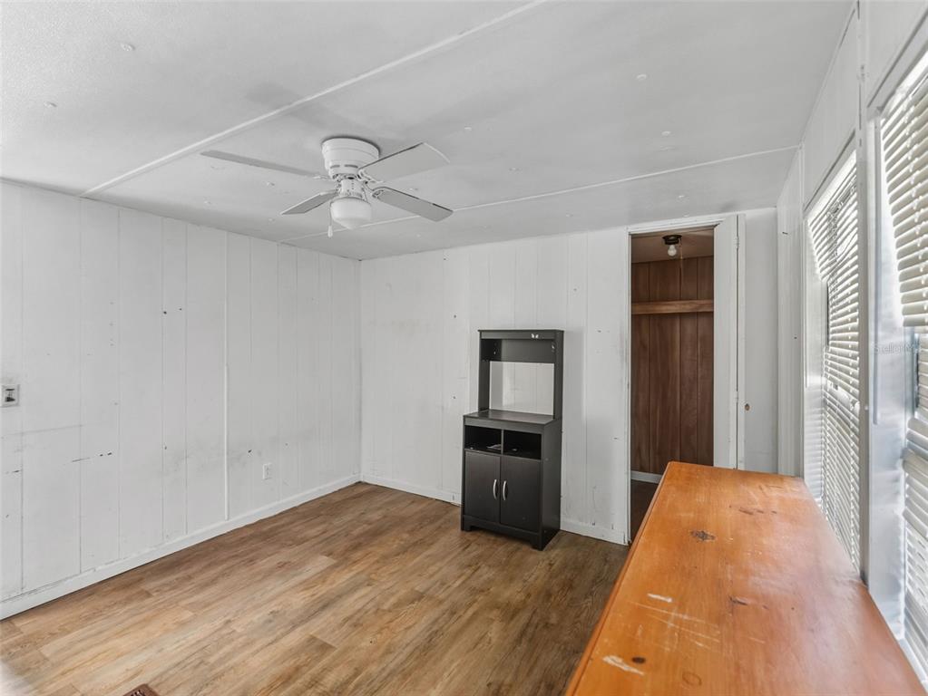 7275 Knowles Road Polk City, FL 33868 - Photo 15 of 39 a big room with closet and wooden floor