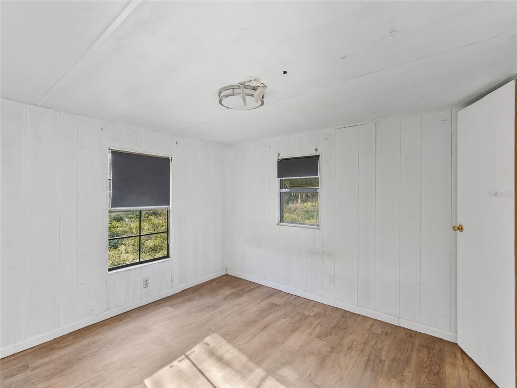 7275 Knowles Road Polk City, FL 33868 - Photo 18 of 39 an empty room with windows