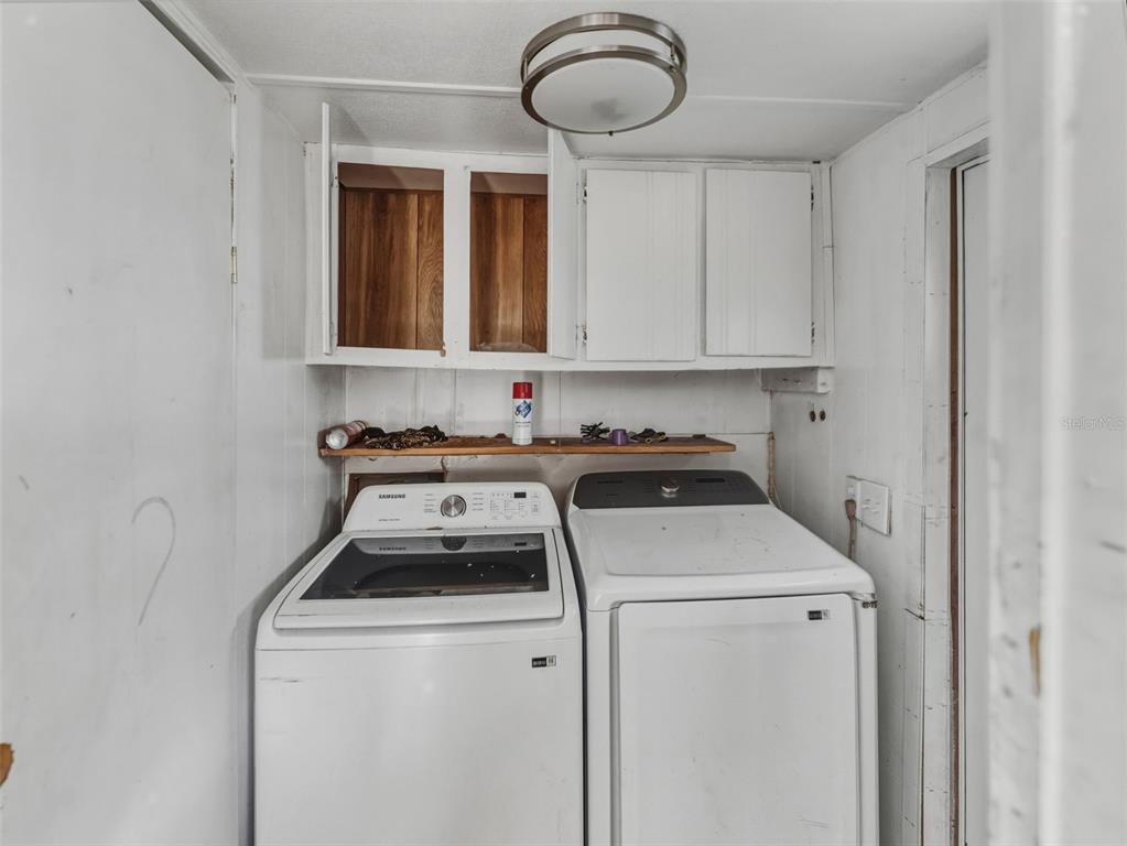7275 Knowles Road Polk City, FL 33868 - Photo 20 of 39 a utility room with dryer and washer